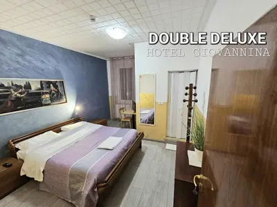 Letto o letti in una camera di Hotel Giovannina