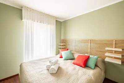 Letto o letti in una camera di GuestHost - Porta Portello Cozy Apartment Padova