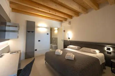 Letto o letti in una camera di Alma Room