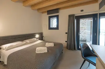 Letto o letti in una camera di Alma Room