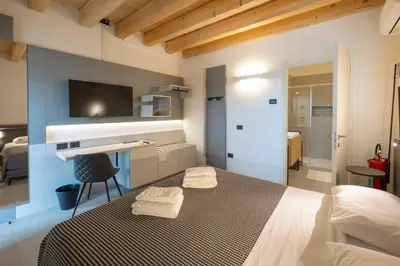 Letto o letti in una camera di Alma Room