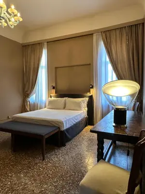 Letto o letti in una camera di Palazzo del '400