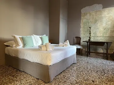 Letto o letti in una camera di Palazzo del '400
