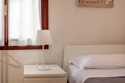 Letto o letti in una camera di San Vito Sweet Home