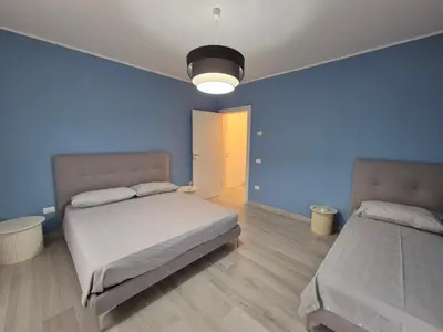 Letto o letti in una camera di Casa Anna