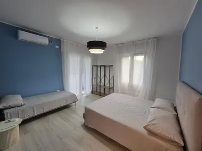 Letto o letti in una camera di Casa Anna