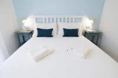 Letto o letti in una camera di Pool, private garden and beach in the city center