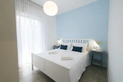 Letto o letti in una camera di Pool, private garden and beach in the city center
