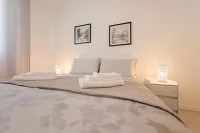 Letto o letti in una camera di Trilocale riammodernato vicino a Venezia & Riviera