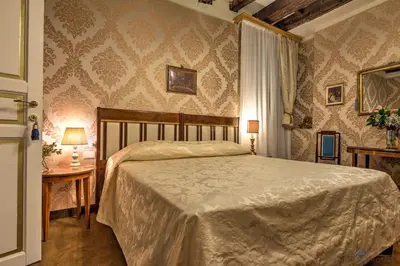 Letto o letti in una camera di Residenza Corte Molin
