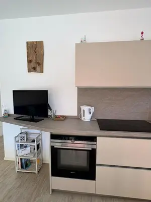 Cucina o angolo cottura di Laguna Palace - nuovo appartamento vicino al mare