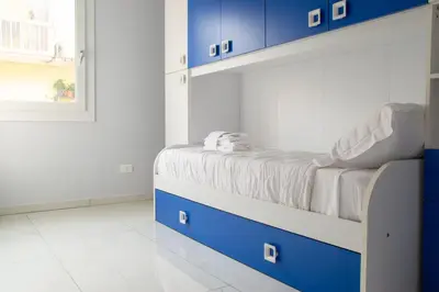 Letto o letti in una camera di Welc-ōM La casa di nonna Tina