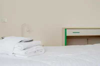 Letto o letti in una camera di Welc-ōM Crescini Padova