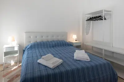 Letto o letti in una camera di Sulla Roggia Flat - Affitti Brevi Italia