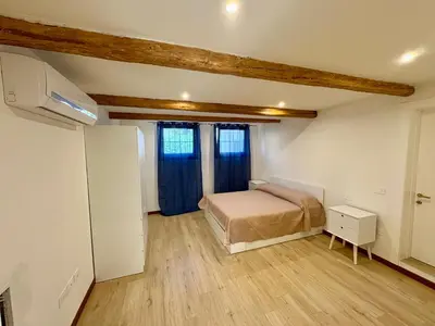Letto o letti in una camera di Ca' Cortese
