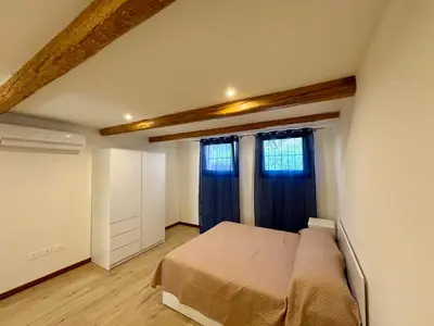 Letto o letti in una camera di Ca' Cortese