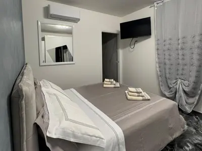 Letto o letti in una camera di Aurora Rooms and Suite