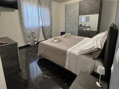 Letto o letti in una camera di Aurora Rooms and Suite