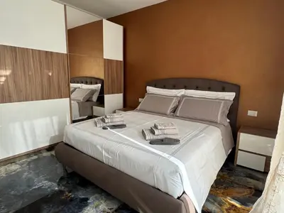 Letto o letti in una camera di Aurora Rooms and Suite