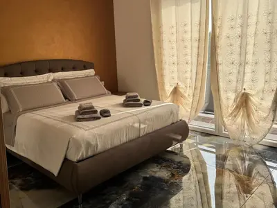 Letto o letti in una camera di Aurora Rooms and Suite