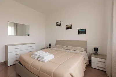 Letto o letti in una camera di Villa Serena, secret garden - 7 min Noventa Outlet