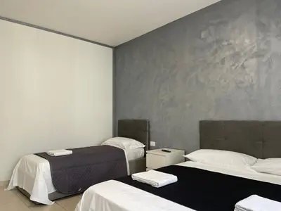Letto o letti in una camera di Venetian Breeze