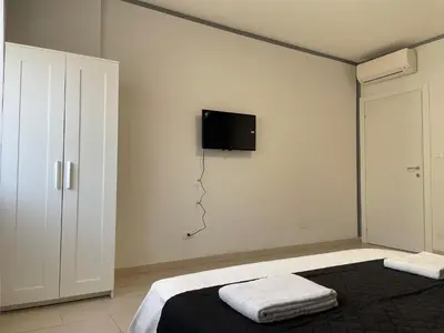 Letto o letti in una camera di Venetian Breeze