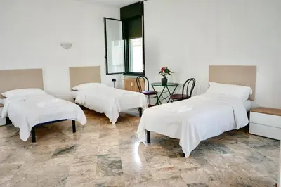 Letto o letti in una camera di Residence Foscolo