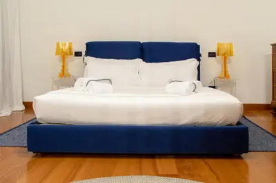 Letto o letti in una camera di Welc-ōM Ivrea Padova Free Parking