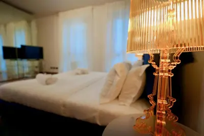 Letto o letti in una camera di Welc-ōM Ivrea Padova Free Parking