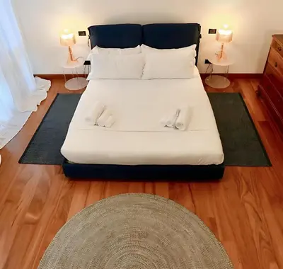 Letto o letti in una camera di Welc-ōM Ivrea Padova Free Parking