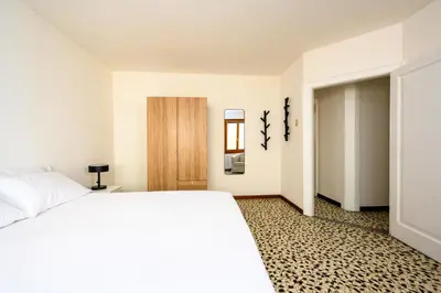 Letto o letti in una camera di Palazzina Pistor 2nd Floor by Sarlux