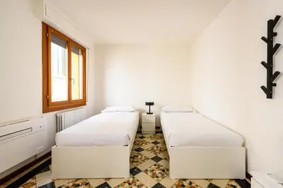 Letto o letti in una camera di Palazzina Pistor 2nd Floor by Sarlux