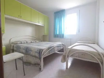 Letto o letti in una camera di Apartments in Rosolina Mare 34043