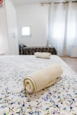 Letto o letti in una camera di Villa Trieste