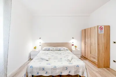 Letto o letti in una camera di Villa Trieste