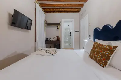 Letto o letti in una camera di Daplace - Antica Casa Coppo
