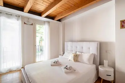 Letto o letti in una camera di GuestHost - Piazza Mazzini Bright Apartment Padova
