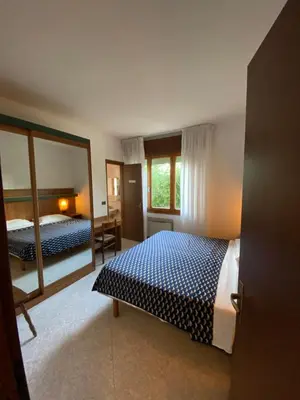 Letto o letti in una camera di Villaggio Margherita