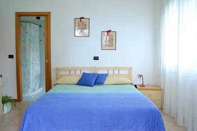 Letto o letti in una camera di Giardino al Mare