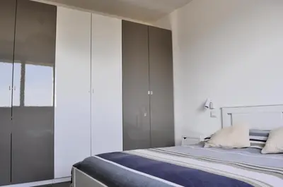 Letto o letti in una camera di Giardino di Lei, appartamento Verde