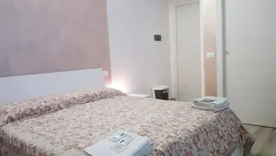 Letto o letti in una camera di B&B Martina