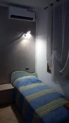 Letto o letti in una camera di B&B Martina
