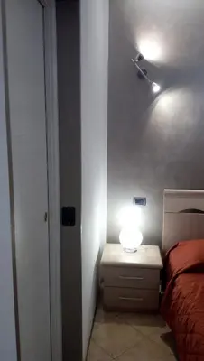 Letto o letti in una camera di B&B Martina