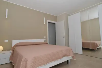 Letto o letti in una camera di Moderno 3 camere con piscina Piazza Aurora