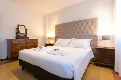 Letto o letti in una camera di Ca' Ramandolo Terrace Apartment