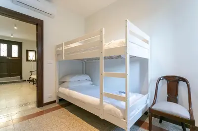 Letto o letti in una camera di Ca' Ramandolo Terrace Apartment