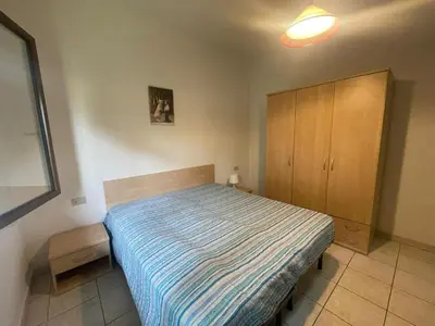 Letto o letti in una camera di Spacious apartment just 200mt from the beach
