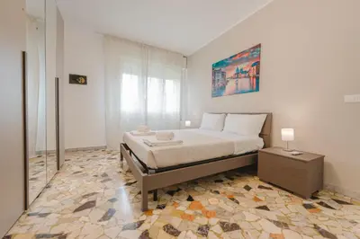 Letto o letti in una camera di Elisa Flat - 15 min from Venice & Wi-Fi