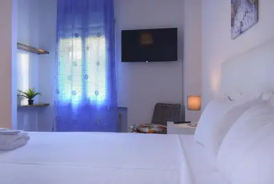Letto o letti in una camera di Welc-ōM Lepanto Relax Apartment